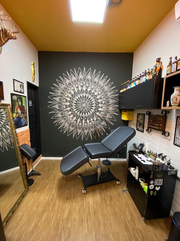 A tattoo station covered with disposable plastic wrap for hygiene.