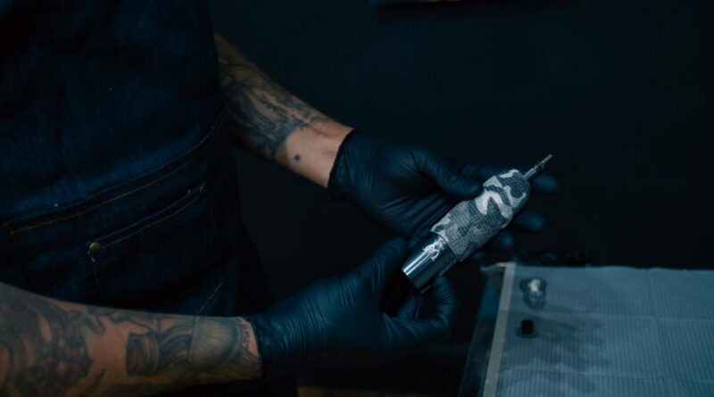 Artist checking tattoo convention dates on a smartphone