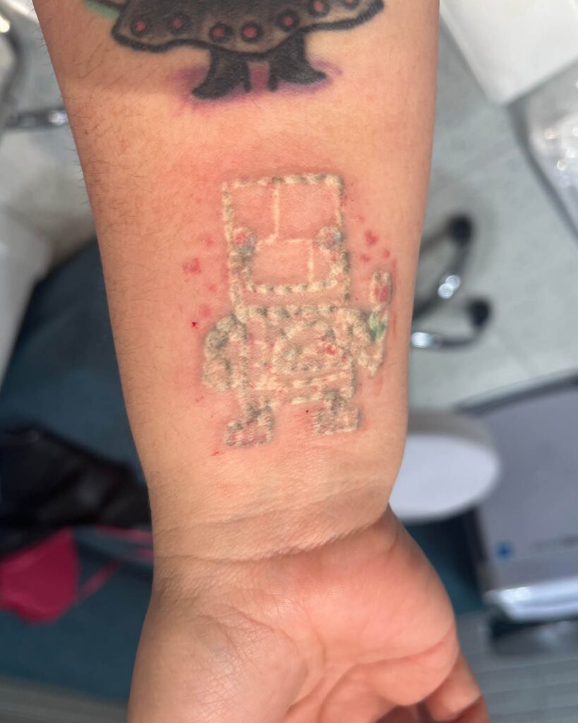 Fresh tattoo covered with transparent aftercare film