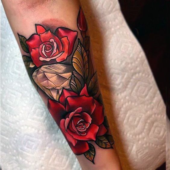 Rose tattoo placed on the shoulder blade