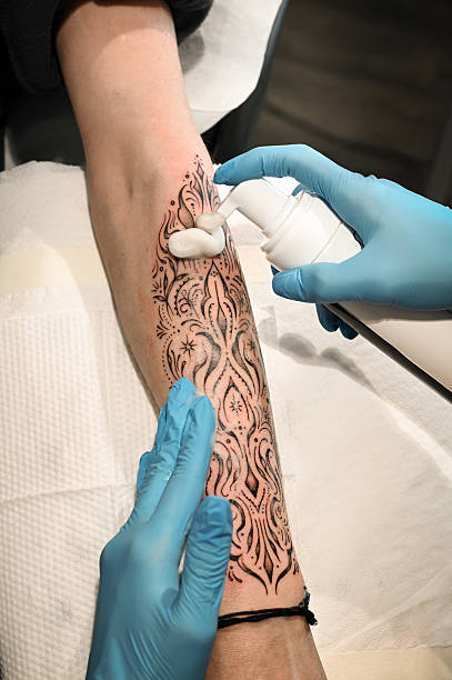 Close up of fine line blackwork tattoo on forearm