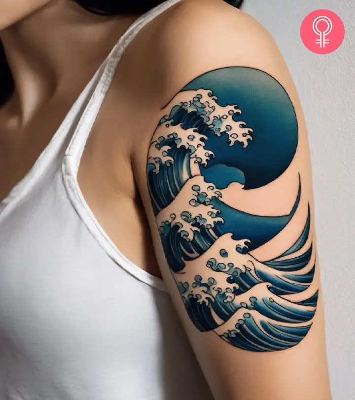 A large back piece featuring cherry blossoms and a phoenix, showing scale and flow.