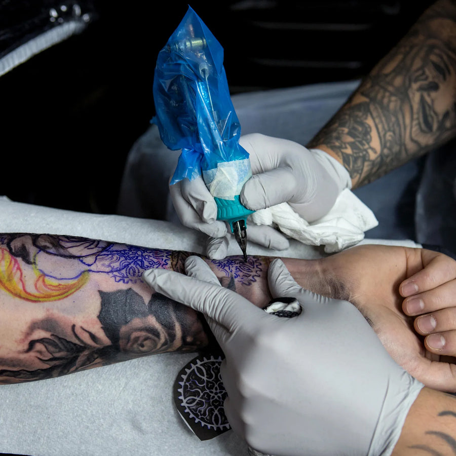 Proper sharps disposal container in a tattoo studio