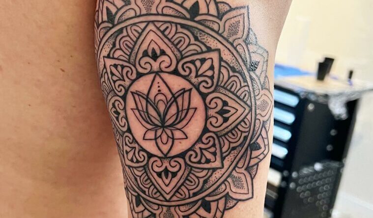 Intricate mandala tattoo sketch on paper