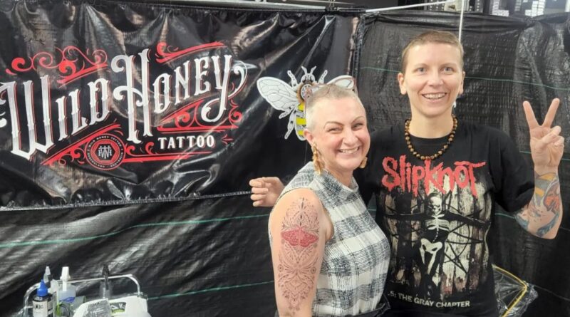 Screenshot of a tattoo convention official website showing event dates and registration