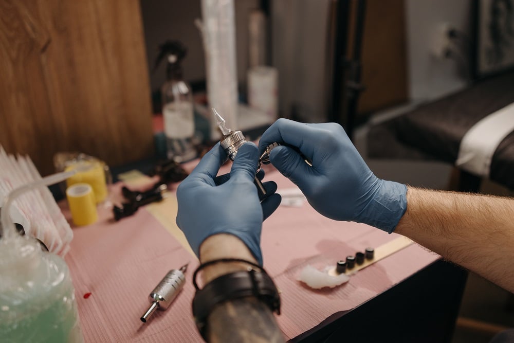 Tattoo pain varies by location; ribcage is known to be more sensitive.