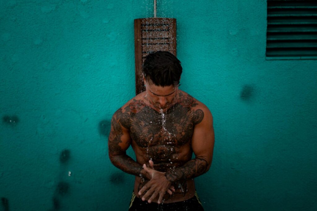 A tattoo aftercare kit including antibacterial soap and healing ointment on a clean surface.