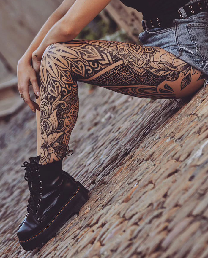 Tattoo artist's consultation desk with design sketches