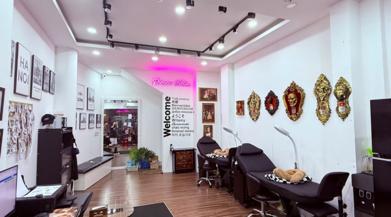 A clean, modern tattoo studio interior in Ho Chi Minh City with organized workstations.