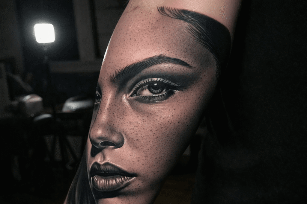 Artist demonstrating whip shading technique on synthetic skin.