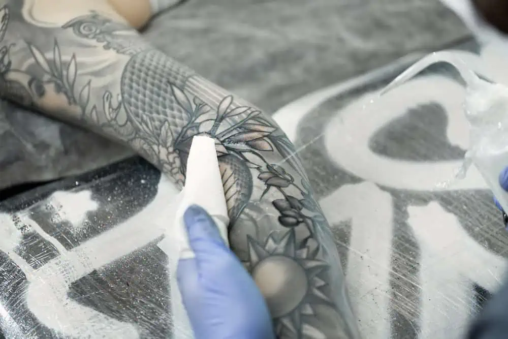 Close-up of a tattoo blowout where ink spread under the skin.