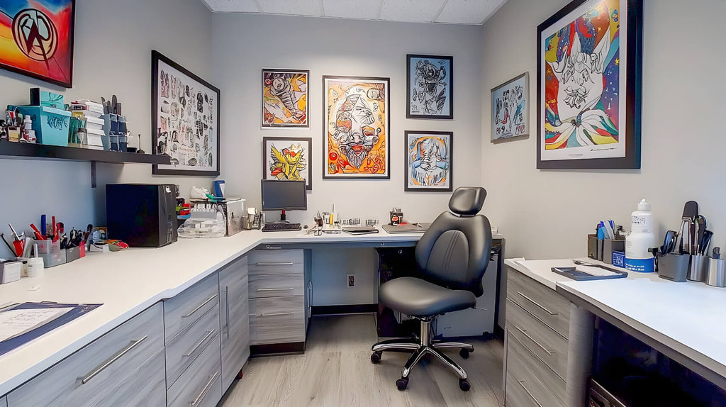 Tattoo artist consultation desk with open portfolio and design sketches