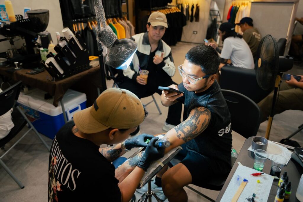 A tidy tattoo station with disposable plastic covers and organized tools.