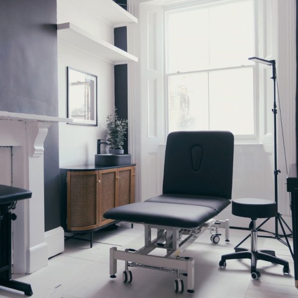 Reception area of a tattoo studio in Hanoi with artwork display