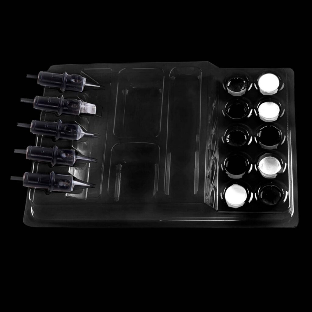 Close-up of a tattoo machine covered with plastic barrier film for hygiene.