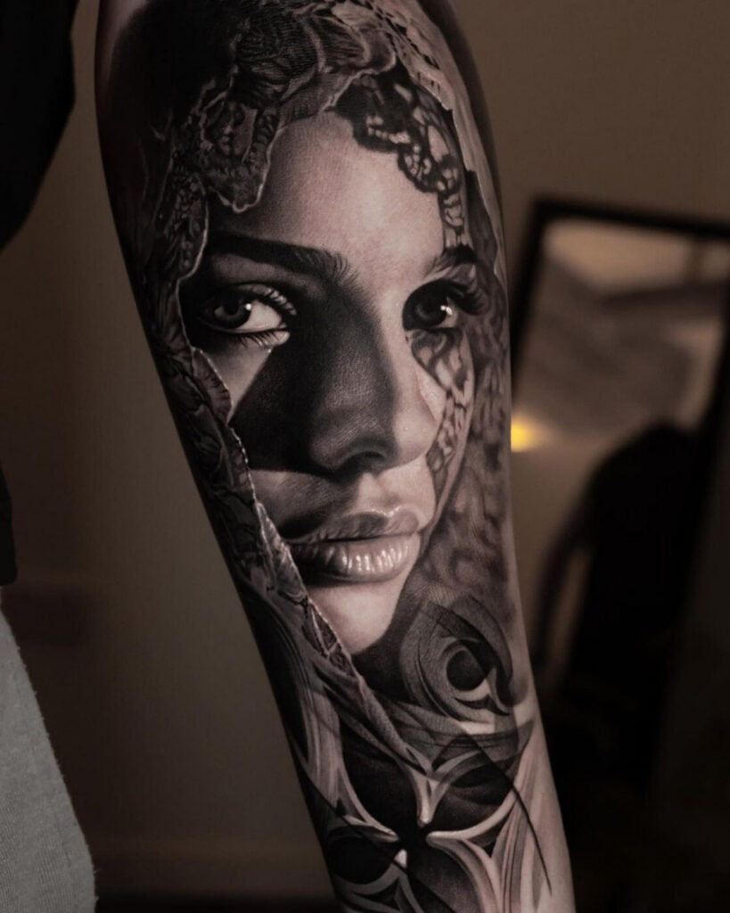 Close-up of a fine line realism tattoo showing detailed wrinkles.