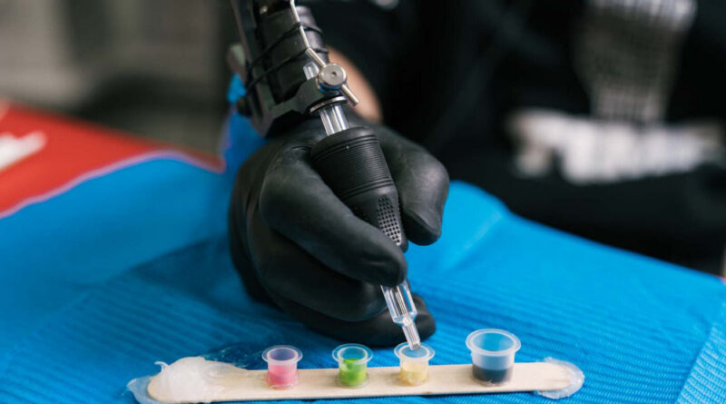 Greywash cups showing different dilution ratios at a tattoo studio.