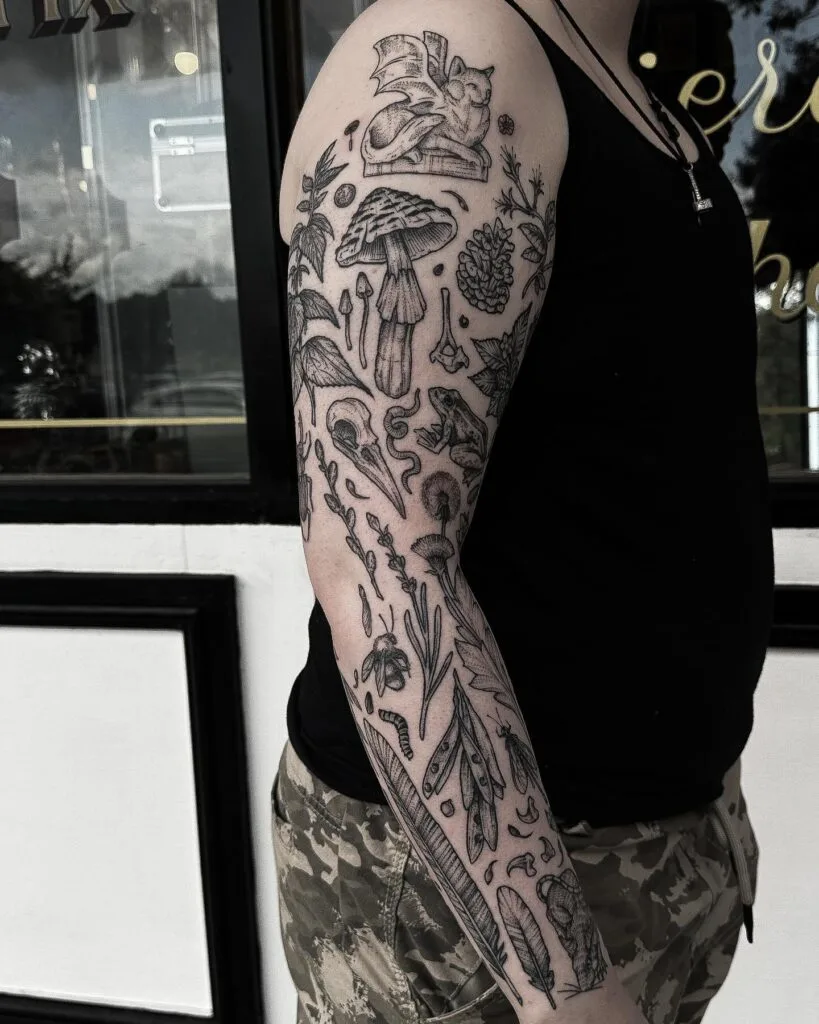 A tattoo artist drawing proposed patchwork tattoos on empty skin sections.