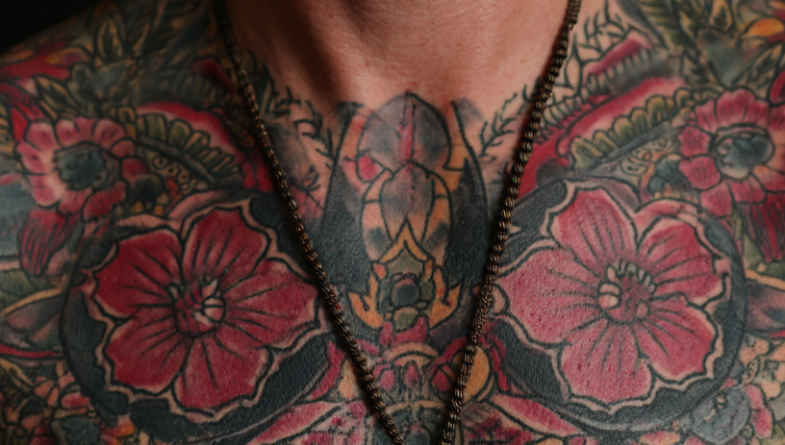 A fine line geometric forearm tattoo following the arm's natural contours.