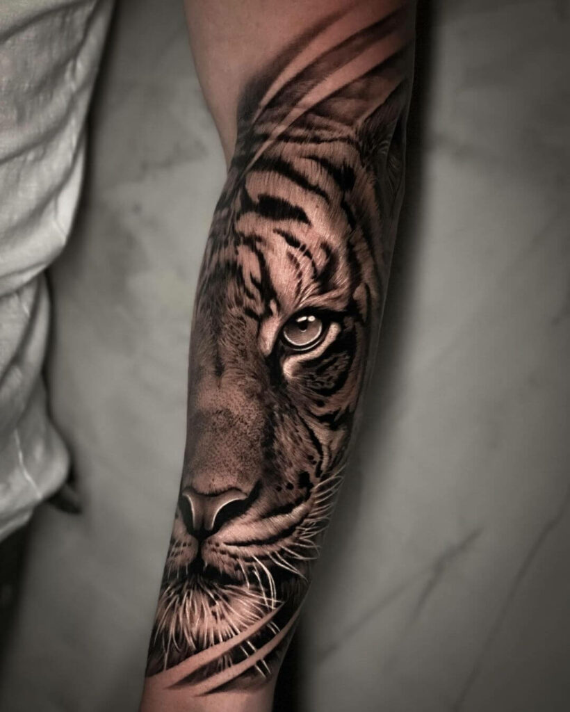 Artist marking placement on the arm before tattooing