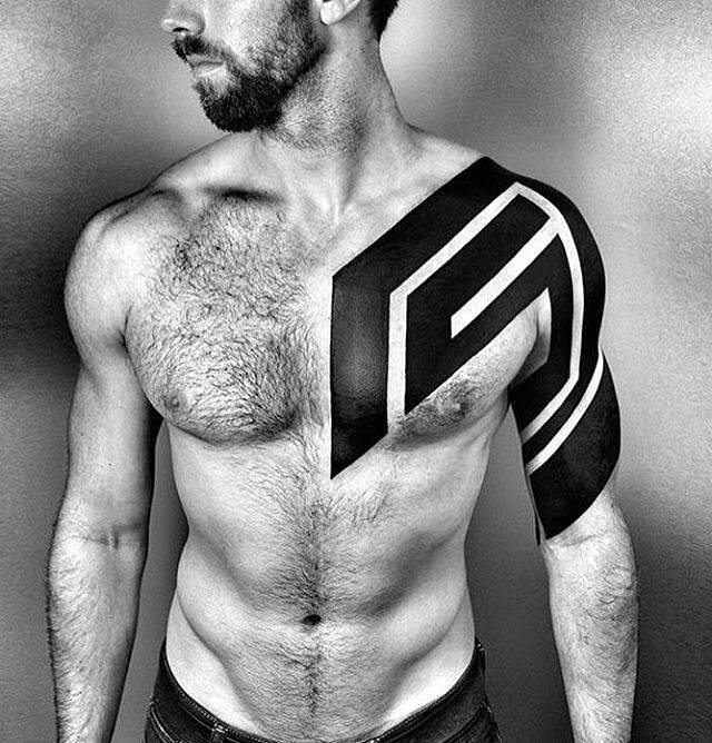 Close-up of blackwork tattoo showing intentional skin breaks