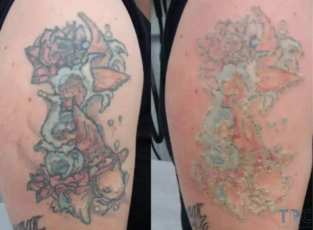 An artist inspects a healed tattoo under a magnifying lamp, checking line quality and color.