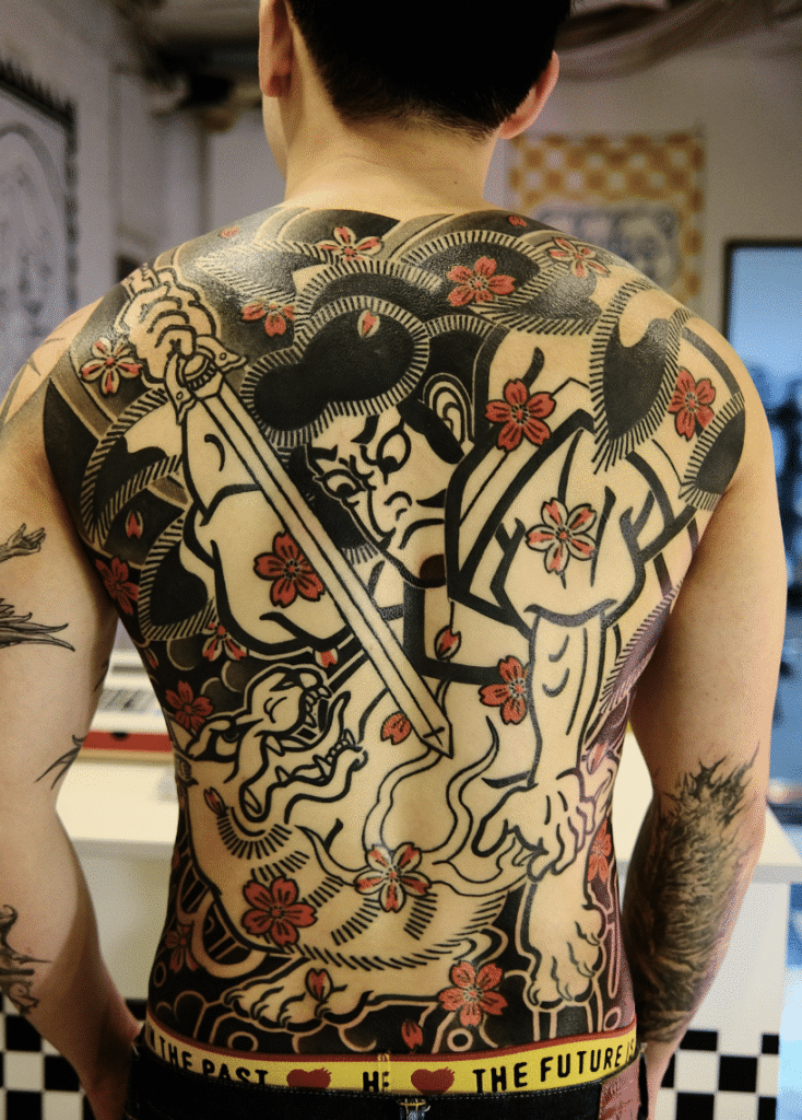 Irezumi seasonal motifs: cherry blossom, peony, koi