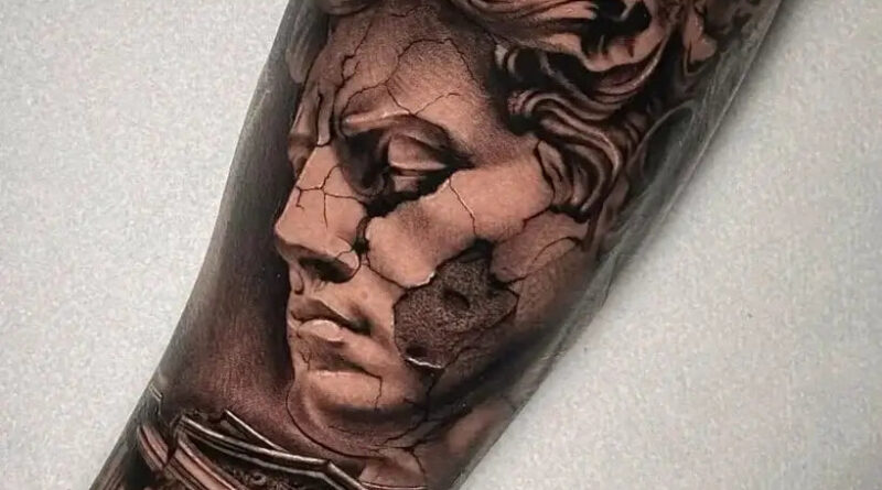 A reference photo with dramatic side lighting to guide the tattoo's shading.