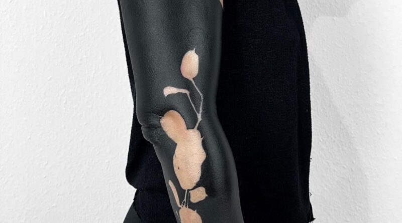 Graphic tattoo sleeve with collage composition and strong contrast