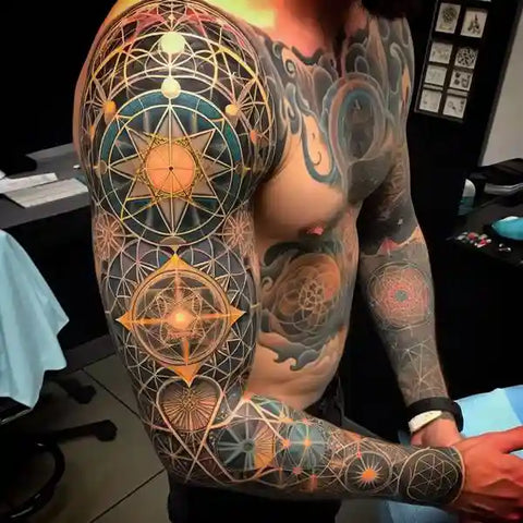 Shoulder and arm graphic tattoo balancing fine line detail and readable mass