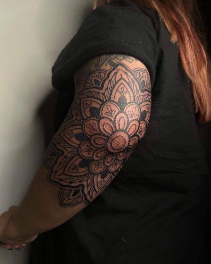 Close-up of ornamental line work on the forearm, showing consistent spacing and rhythm.