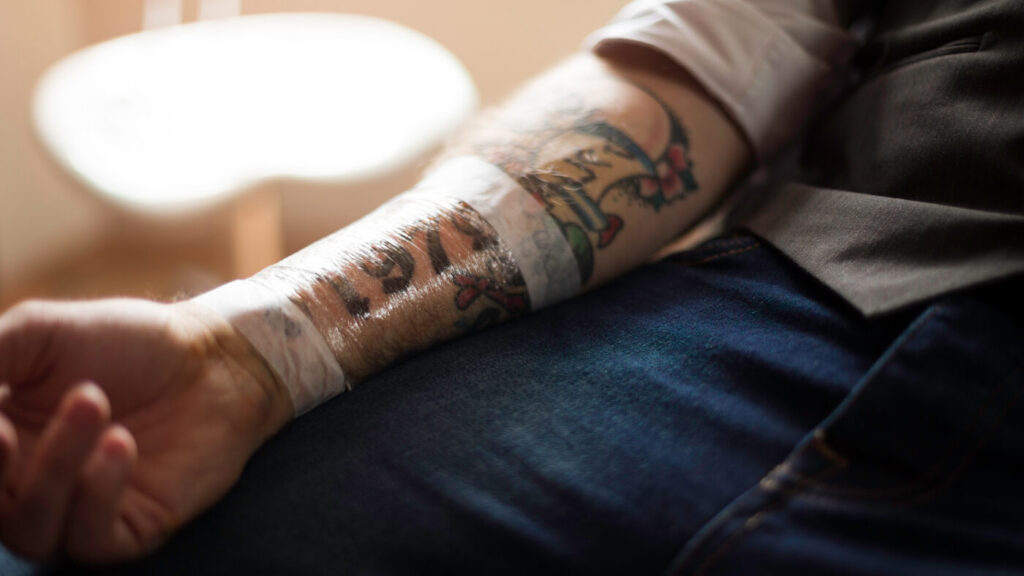 The tattooing process triggers an inflammatory response that causes swelling.