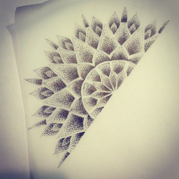 Applying aftercare cream on a fresh dotwork tattoo.